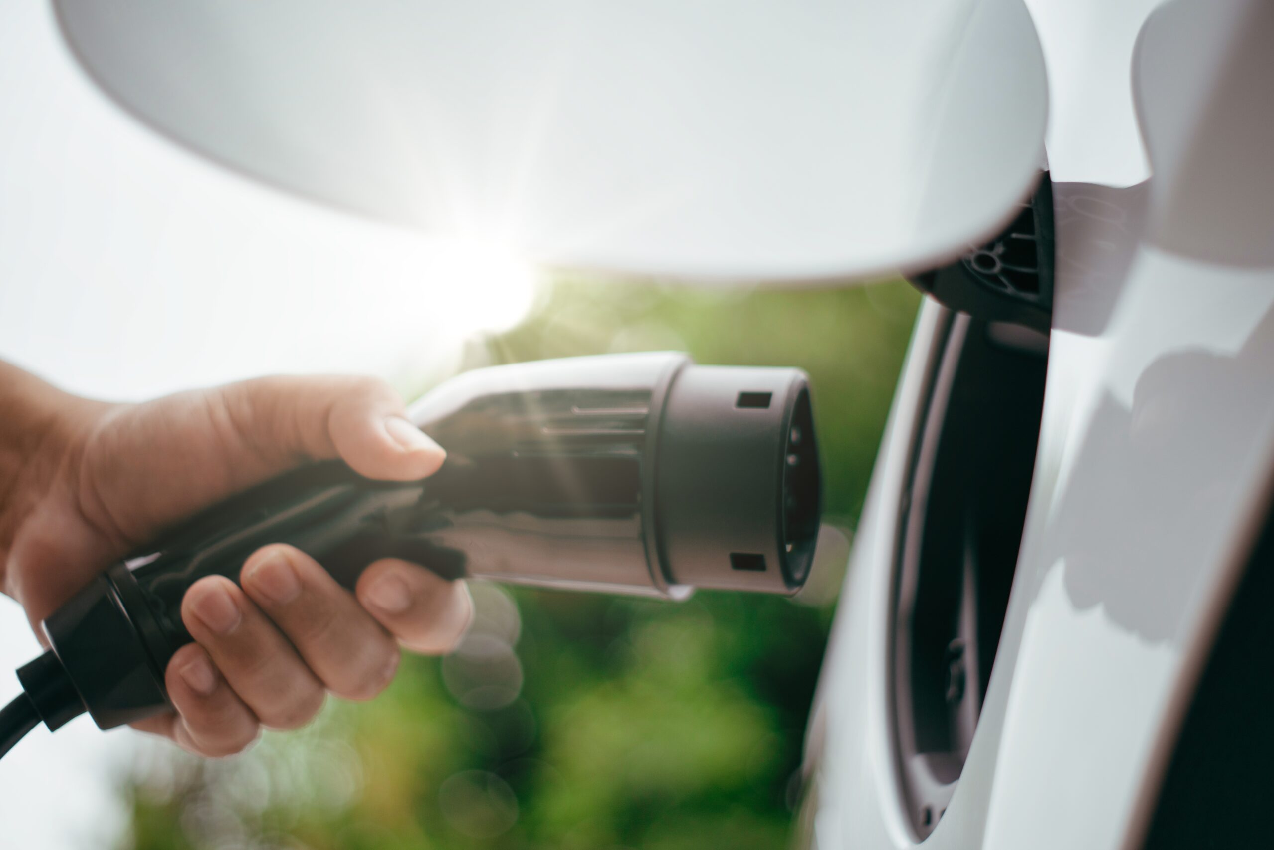 Electric vehicle is charging at station
